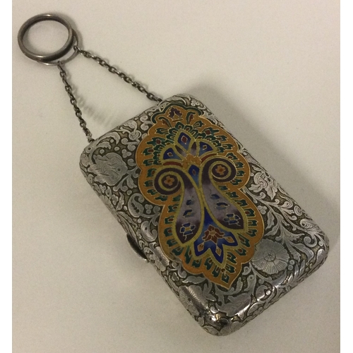 283 - A Continental silver and enamelled purse with suspension chain. Approx. 107 grams. Est. £200 - £300.