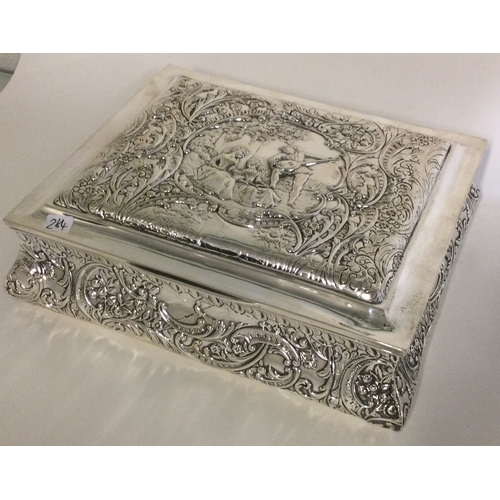 284 - A large chased silver jewellery box with embossed decoration. Birmingham 1905. Approx. 618 grams. Es... 