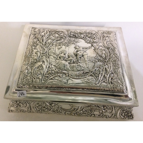 284 - A large chased silver jewellery box with embossed decoration. Birmingham 1905. Approx. 618 grams. Es... 