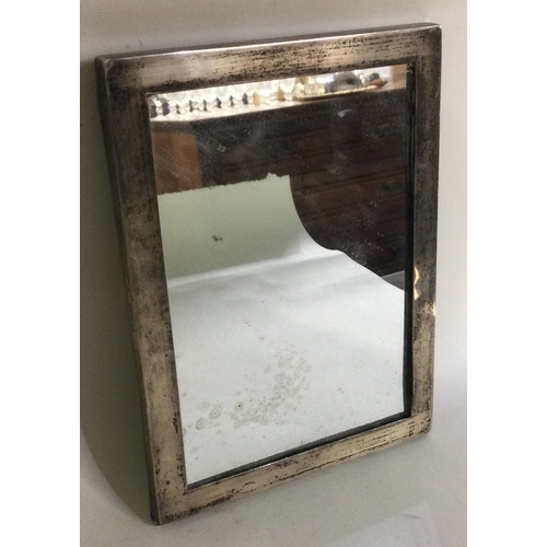 285 - A silver mounted mirror frame. Sheffield 1927. By Walker & Hall. Est. £50 - £80.