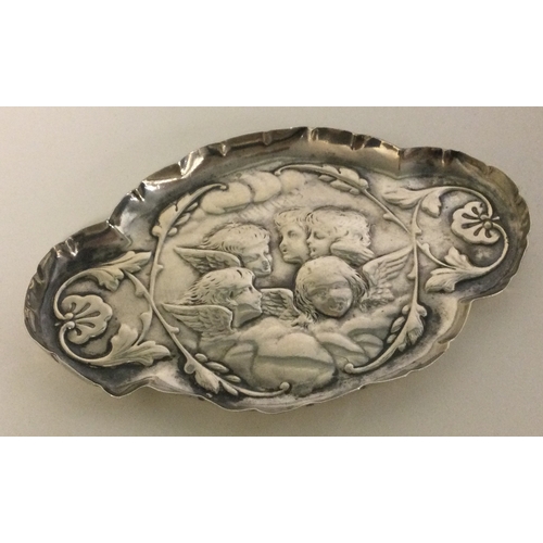 287 - A silver chased tray embossed with cherubs. London 1903. Approx. 39 grams. Est. £30 - £50.