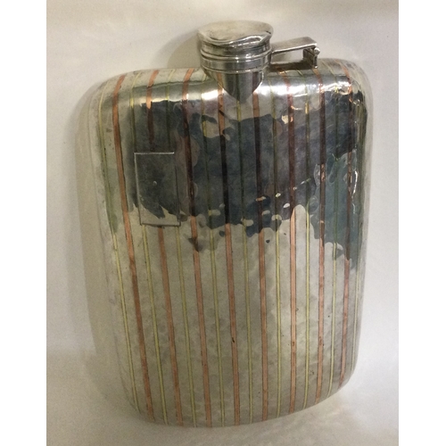 290 - A large American silver and gold inlaid flask. Approx. 304 grams. Est. £500 - £800.