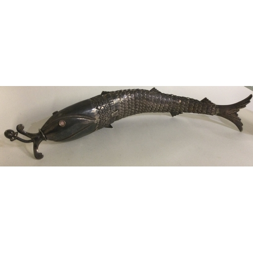 301 - A large heavy silver articulated figure of a fish. Approx. 236 grams. Est. £300 - £500.