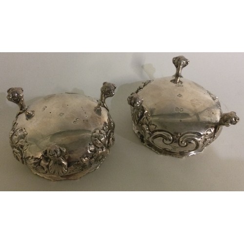 324 - A pair of Victorian chased silver salts on feet. London 1862. By Daniel & Charles Houle. Approx. 185... 