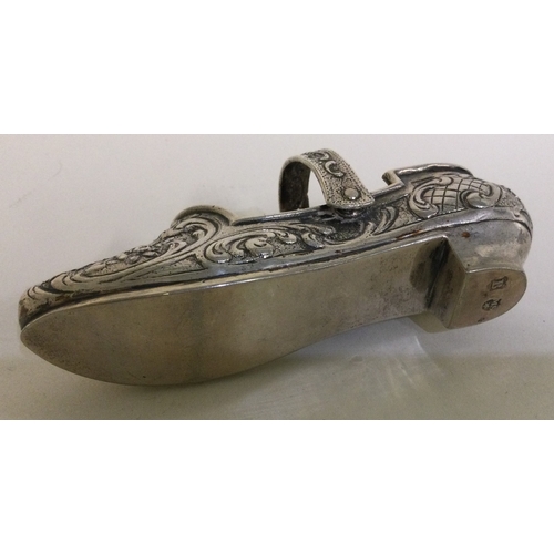 348 - A German silver model of a shoe with adjustable handle. Approx. 57 grams. Est. £150 - £200.