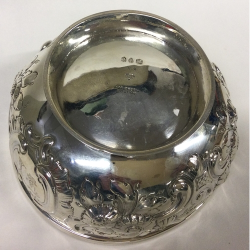 365 - A chased Victorian silver bowl embossed with flowers. London 1890. By Dobson & Sons. Approx. 250 gra... 