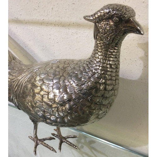 374 - A large 19th Century silver figure of a pheasant with pull-off head. London 1913. Import marks for B... 