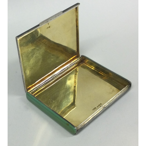 406 - A silver and enamelled hinged snuff box bearing import marks. Approx. 108 grams. Est. £120 - £150.