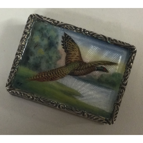 413 - A silver and enamelled snuff box depicting a pheasant to gilt interior. Birmingham 1980. By SJR. App... 