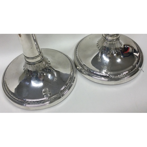 416 - A large pair of Georgian silver crested candlesticks. London 1773. By John Parsons & Co. Approx. 154... 