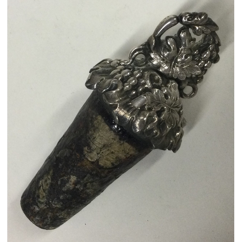 428 - A Victorian silver bottle stopper with grape and vine decoration. Approx. 37 grams. Est. £50 - £80.