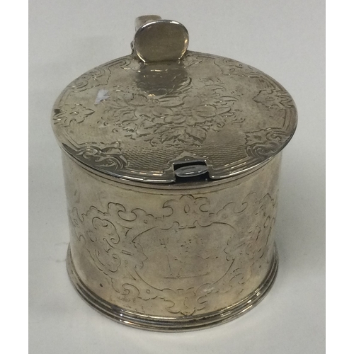 437 - A Victorian silver and glass mustard pot. London 1859. By Barnards. Approx. 127 grams. Est. £100 - £... 