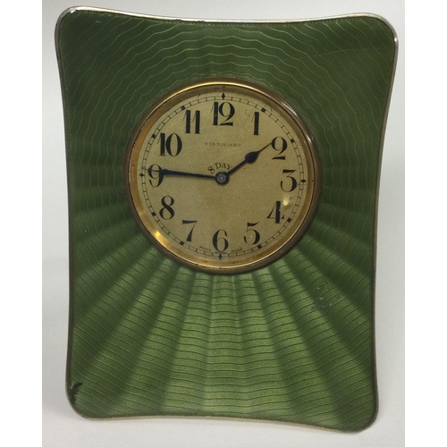 450 - A large silver and green enamelled clock bearing import marks. Approx. 316 grams. Est. £500 - £800.