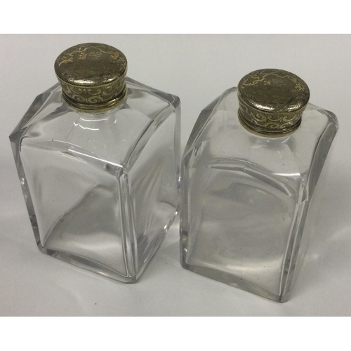 452 - A pair of Georgian silver gilt and glass perfume bottles. London 1831. By CJB. Est. £60 - £80.