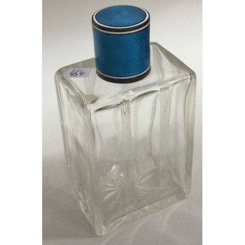 454 - A silver and blue enamelled glass scent bottle. Est. £40 - £60.