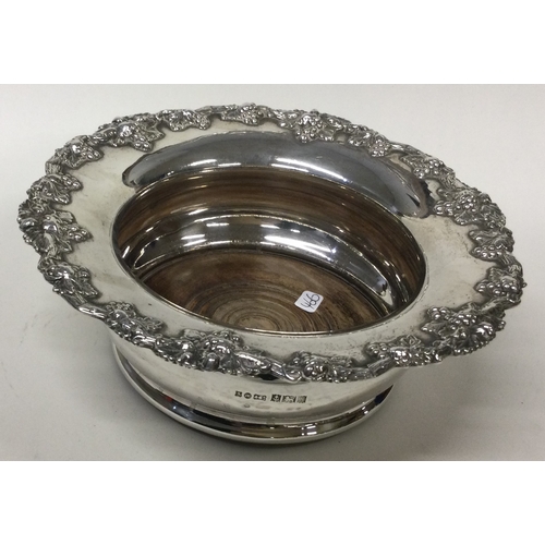 466 - A large silver mounted wine coaster. Birmingham 1992. Approx. 332 grams of gross weight. Est. £150 -... 