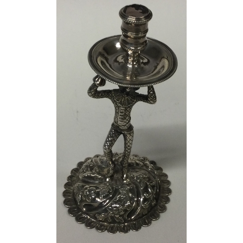 498 - A Harlequin silver taperstick. Circa 1750. Approx. 100 grams. Est. £400 - £600.