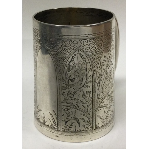 504 - A novelty Victorian silver panelled mug engraved with birds, butterflies, ducks, and spiderwebs. Lon... 