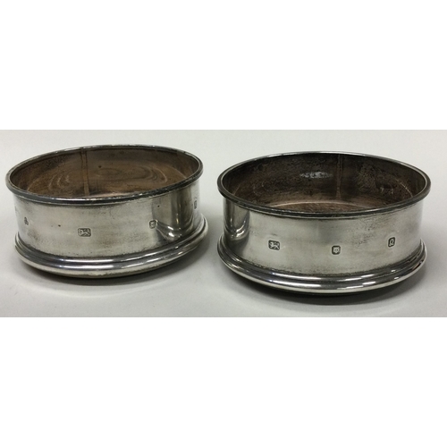 505 - A pair of silver bottle coasters. London 1990 / 91. By M C Hersey & Son Ltd. Approx. 165 grams. Est.... 