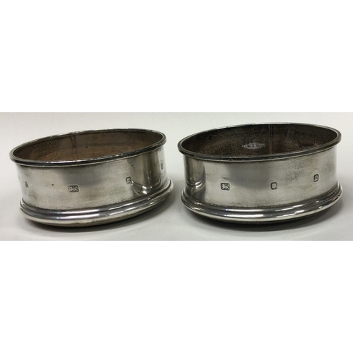 505 - A pair of silver bottle coasters. London 1990 / 91. By M C Hersey & Son Ltd. Approx. 165 grams. Est.... 