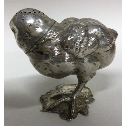 517 - A heavy Victorian silver pepper in the form of a chick. Approx. 146 grams. Est. £400 - £600.