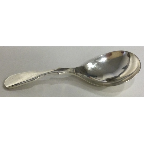 523 - A modernistic silver caddy spoon. Approx. 20 grams. Est. £30 - £50.