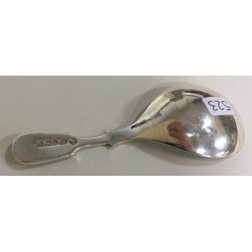 523 - A modernistic silver caddy spoon. Approx. 20 grams. Est. £30 - £50.