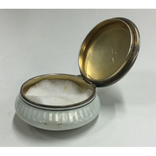 56 - A silver and enamelled box bearing import marks. Approx. 77 grams. Est. £100 - £150.