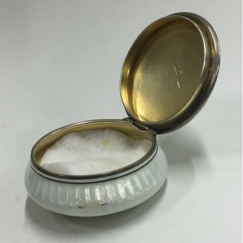 56 - A silver and enamelled box bearing import marks. Approx. 77 grams. Est. £100 - £150.