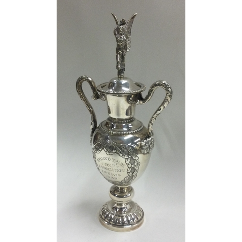 63 - A fine silver figural cup and cover with embossed decoration. Birmingham 1948. By Alexander Clark & ... 