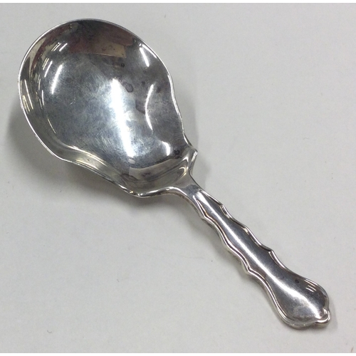 87 - A George III silver caddy spoon with bright cut decoration. Birmingham 1824. By John Bettridge. Appr... 