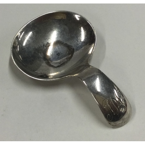 89 - A Georgian style silver caddy spoon. London 1969. By R&K. Approx. 11 grams. Est. £30 - £60.