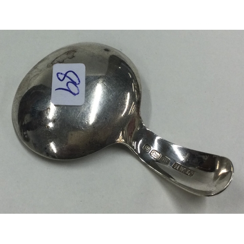 89 - A Georgian style silver caddy spoon. London 1969. By R&K. Approx. 11 grams. Est. £30 - £60.