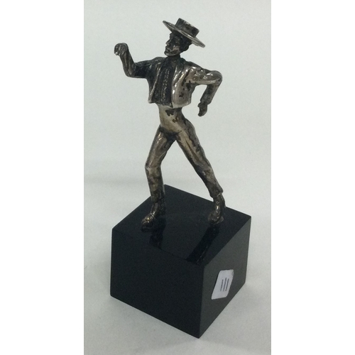 111 - A silver figure of a man on plinth. Approx. 49 grams of gross weight. Est. £20 - £30.