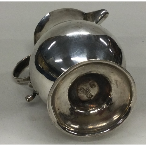 130 - An 18th Century Georgian silver sparrow beak cream jug. London 1741. Approx. 58 grams. Est. £200 - £... 