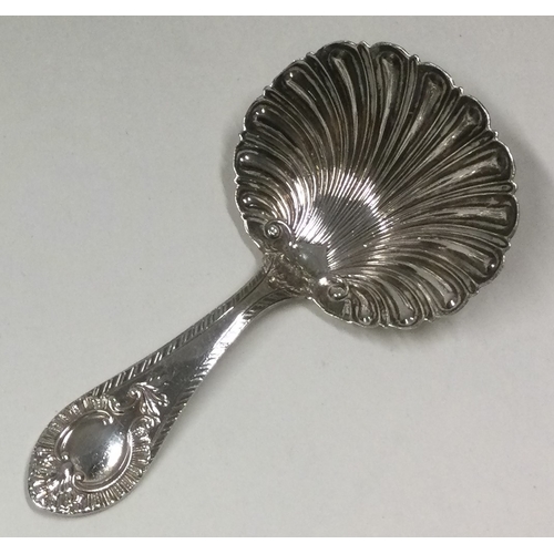 137 - A Silver caddy spoon. Sheffield 1906. By W&H. Approx. 15 grams. Est. £20 - £30.