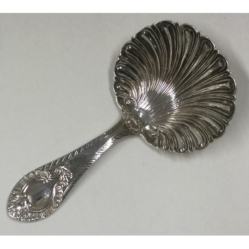 137 - A Silver caddy spoon. Sheffield 1906. By W&H. Approx. 15 grams. Est. £20 - £30.