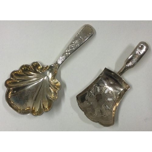 140 - Two silver caddy spoons. London by HG and Birmingham 1814 by IT. Approx. 24 grams. Est. £30 - £40.