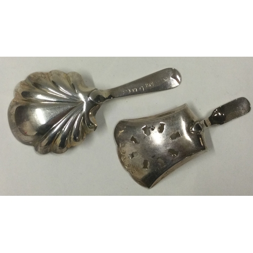 140 - Two silver caddy spoons. London by HG and Birmingham 1814 by IT. Approx. 24 grams. Est. £30 - £40.