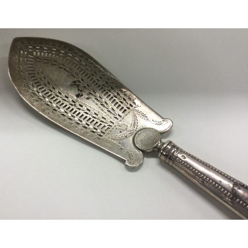 162 - A large pierced Georgian silver fish slice with bright cut decoration. London 1784. By Thomas Daniel... 