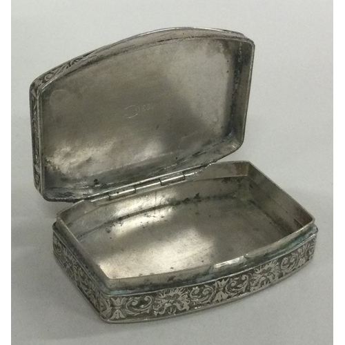 165 - An engraved Continental silver hinged pill box. Marked to interior. Approx. 24 grams. Est. £30 - £50... 