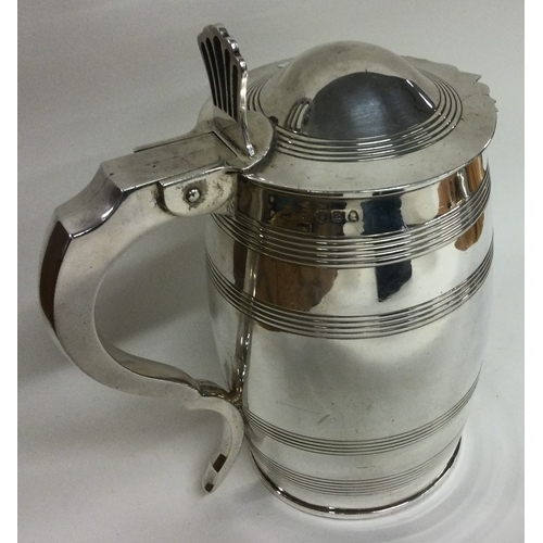 167 - An 18th Century George III silver reeded tankard. London 1797. Approx. 895 grams. Est. £1000 - £1500... 