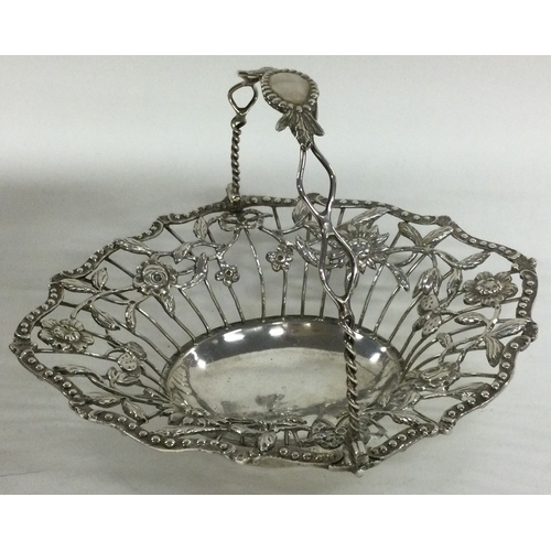 196 - A Georgian silver swing handled basket with pierced decoration. London 1770. Approx. 145 grams. Est.... 