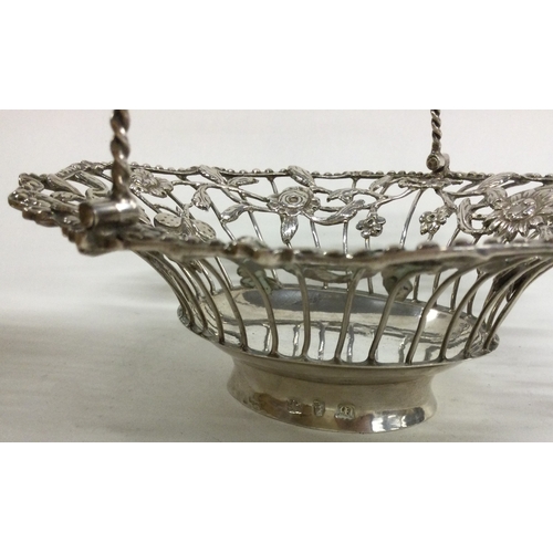 196 - A Georgian silver swing handled basket with pierced decoration. London 1770. Approx. 145 grams. Est.... 