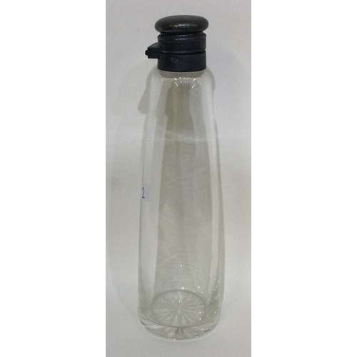 2 - A small silver mounted tapering bottle. Est. £20 - £30.