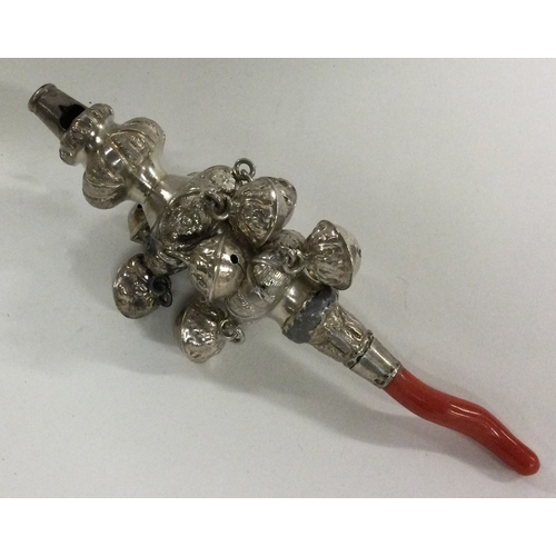 233 - A George III silver rattle with coral teether. Circa 1800. Approx. grams. Est. £80 - £120.