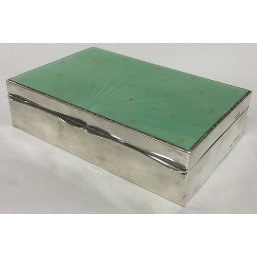 238 - A large silver and enamelled cigar box. Birmingham 1957. By Albert Carter. Approx. 466 grams. Est. £... 