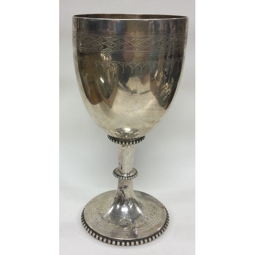 243 - A large Victorian silver goblet. London 1876. By Charles Boyton. Approx. 373 grams. Est. £250 - £300... 