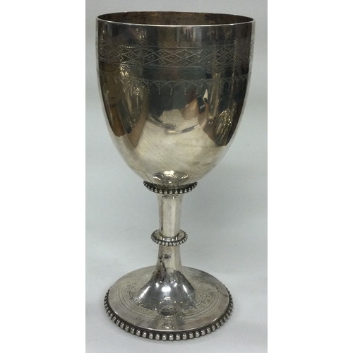 243 - A large Victorian silver goblet. London 1876. By Charles Boyton. Approx. 373 grams. Est. £250 - £300... 