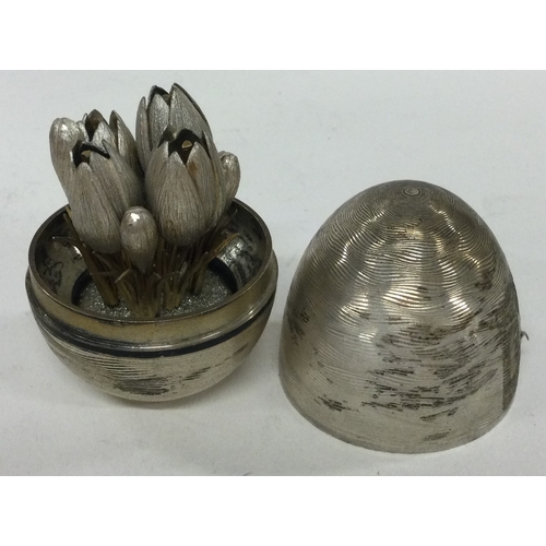 245 - A contemporary English silver 'Surprise' egg. Marked to base. Approx. 126 grams. Est. £140 - £160.